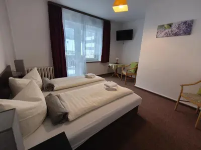 Ein Bett oder Betten in einem Zimmer der Unterkunft Ferienhotel Zwotatal