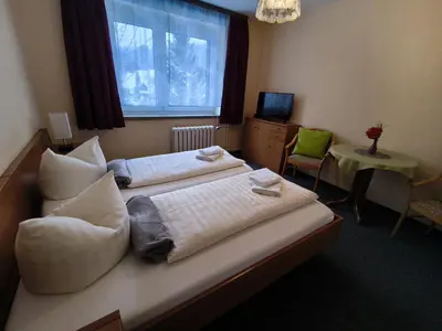 Ein Bett oder Betten in einem Zimmer der Unterkunft Ferienhotel Zwotatal