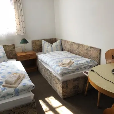Ein Bett oder Betten in einem Zimmer der Unterkunft Pension Untere Rauner Muehle