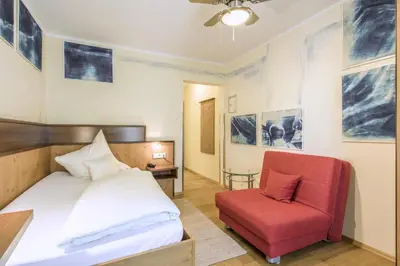Ein Bett oder Betten in einem Zimmer der Unterkunft Hotel Brunner