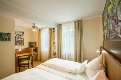 Ein Bett oder Betten in einem Zimmer der Unterkunft Hotel Brunner
