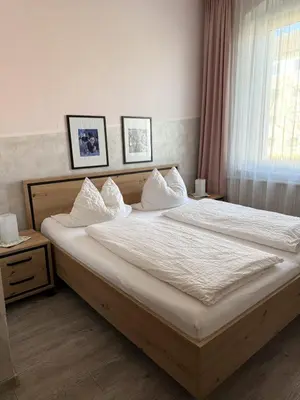 Ein Bett oder Betten in einem Zimmer der Unterkunft Hotel Weile