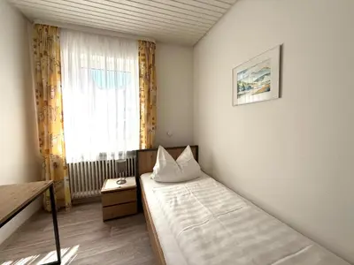 Ein Bett oder Betten in einem Zimmer der Unterkunft Hotel Weile
