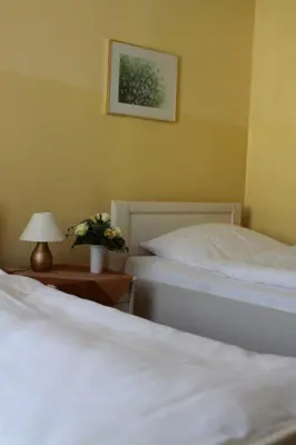 Ein Bett oder Betten in einem Zimmer der Unterkunft Hotel Weile