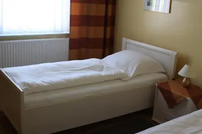 Ein Bett oder Betten in einem Zimmer der Unterkunft Hotel Weile