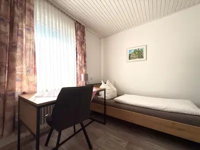 Ein Bett oder Betten in einem Zimmer der Unterkunft Hotel Weile