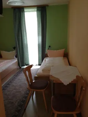 Ein Bett oder Betten in einem Zimmer der Unterkunft Hotel Gasthof Turm
