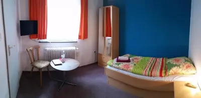 Ein Bett oder Betten in einem Zimmer der Unterkunft Hotel-Pension Dressel