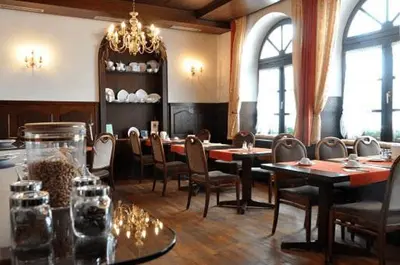 Ein Restaurant oder anderes Speiselokal in der Unterkunft Hotel Grader