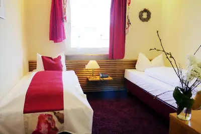 Ein Bett oder Betten in einem Zimmer der Unterkunft Hotel Grader
