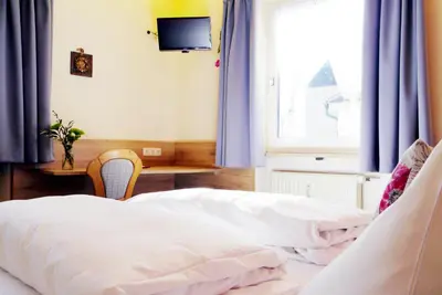 Ein Bett oder Betten in einem Zimmer der Unterkunft Hotel Grader