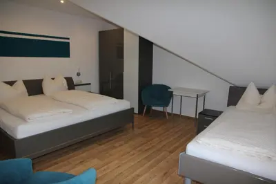 Ein Bett oder Betten in einem Zimmer der Unterkunft Ute's Pension