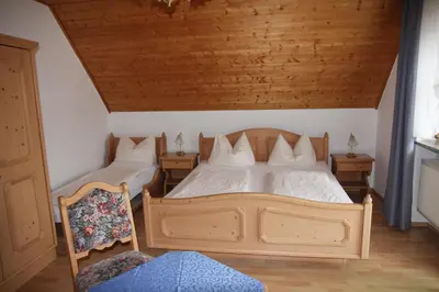 Ein Bett oder Betten in einem Zimmer der Unterkunft Ute's Pension
