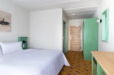 Ein Bett oder Betten in einem Zimmer der Unterkunft IFA Schöneck Hotel & Ferienpark
