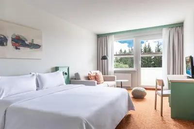 Ein Bett oder Betten in einem Zimmer der Unterkunft IFA Schöneck Hotel & Ferienpark