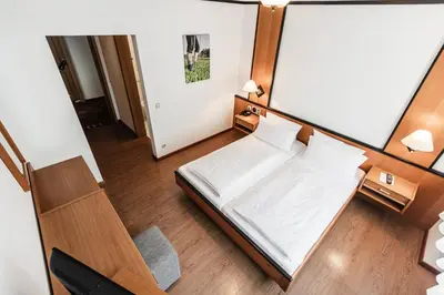 Ein Bett oder Betten in einem Zimmer der Unterkunft Landidyll Hotel Zum Alten Schloss