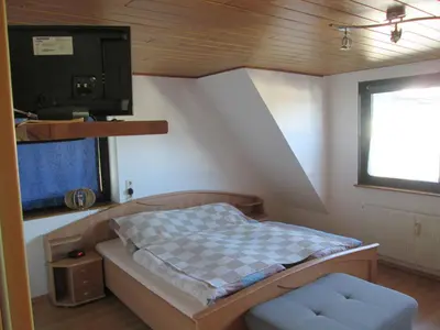 Ein Bett oder Betten in einem Zimmer der Unterkunft FeWo Ahornweg