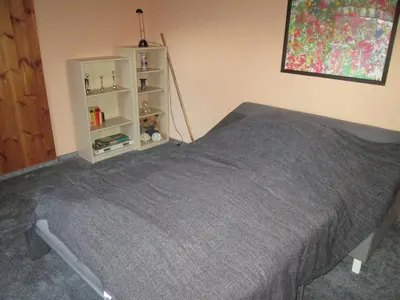 Ein Bett oder Betten in einem Zimmer der Unterkunft FeWo Ahornweg
