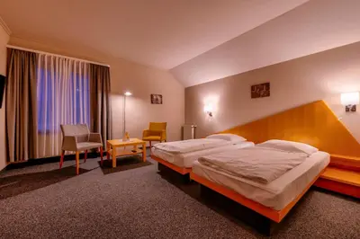 Ein Bett oder Betten in einem Zimmer der Unterkunft Golfhotel Fahrenbach
