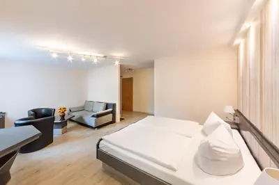 Ein Bett oder Betten in einem Zimmer der Unterkunft Hotel Forstmeister
