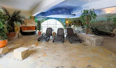 Ein Sitzbereich in der Unterkunft Hotel Reiterhof