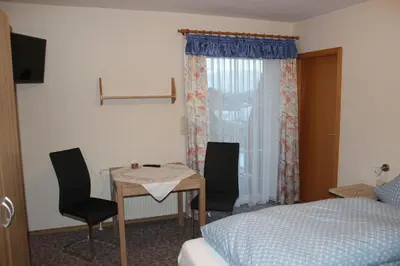 Ein Bett oder Betten in einem Zimmer der Unterkunft Gasthaus Zur Waldesruh