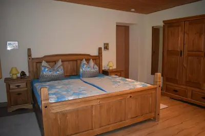 Ein Bett oder Betten in einem Zimmer der Unterkunft Ferienwohnung Sternkopf