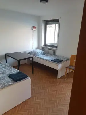 Ein Bett oder Betten in einem Zimmer der Unterkunft Monteurunterkunft Königstein
