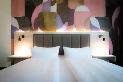 Ein Bett oder Betten in einem Zimmer der Unterkunft Taste Hotel Kulmbach