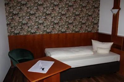 Ein Bett oder Betten in einem Zimmer der Unterkunft Hotel & Landgasthof Forsthof