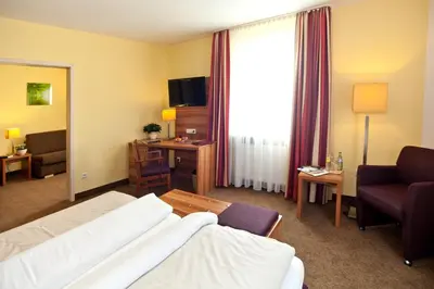 Ein Bett oder Betten in einem Zimmer der Unterkunft Hotel Strauss