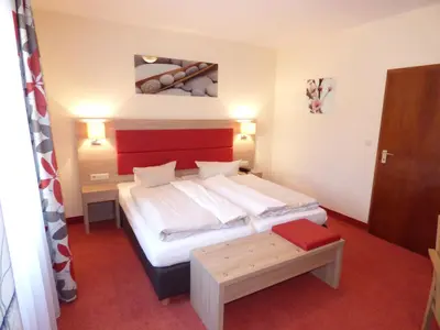 Ein Bett oder Betten in einem Zimmer der Unterkunft Hotel Strauss