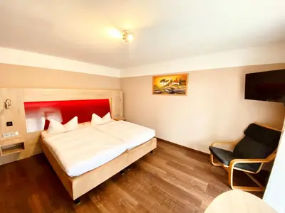 Ein Bett oder Betten in einem Zimmer der Unterkunft Hotel garni Kleindienst