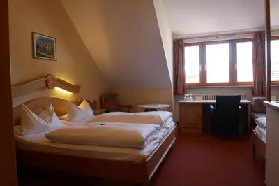 Ein Bett oder Betten in einem Zimmer der Unterkunft Hotel Gasthof Hereth