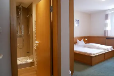 Ein Bett oder Betten in einem Zimmer der Unterkunft Hotel Gasthof Hereth