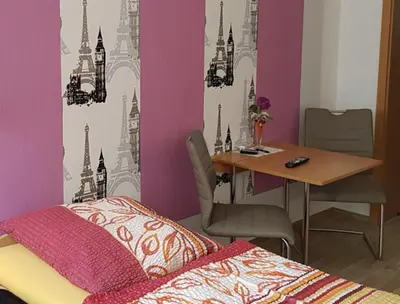 Ein Bett oder Betten in einem Zimmer der Unterkunft Ferienwohnung zum 
