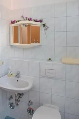 Ein Badezimmer in der Unterkunft Ferienwohnung zum 