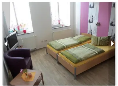 Ein Bett oder Betten in einem Zimmer der Unterkunft Ferienwohnung zum 