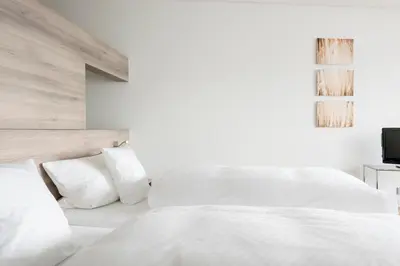 Ein Bett oder Betten in einem Zimmer der Unterkunft Landhotel Weißes Roß