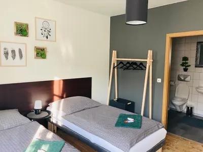Ein Bett oder Betten in einem Zimmer der Unterkunft Pension Boulevard