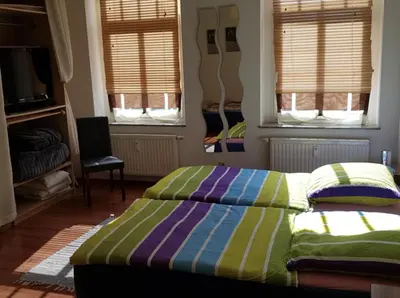 Ein Bett oder Betten in einem Zimmer der Unterkunft Vorbeischauen in Plauen 2