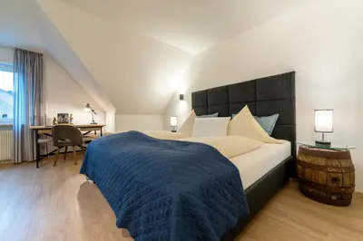 Ein Bett oder Betten in einem Zimmer der Unterkunft Sperber Bräu - 3-Sterne-Superior Hotel mit Gasthof und eigener Brauerei - kein Ruhetag