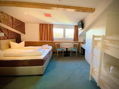Ein Bett oder Betten in einem Zimmer der Unterkunft Meister BÄR HOTEL Frankenwald