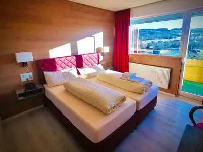 Ein Bett oder Betten in einem Zimmer der Unterkunft Meister BÄR HOTEL Frankenwald