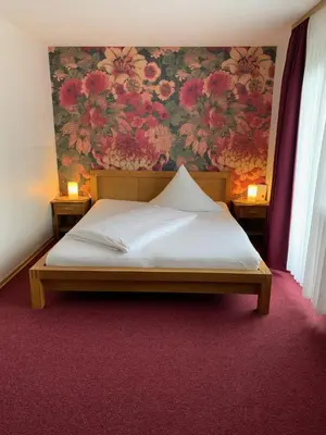 Ein Bett oder Betten in einem Zimmer der Unterkunft Landhaus Am Forst