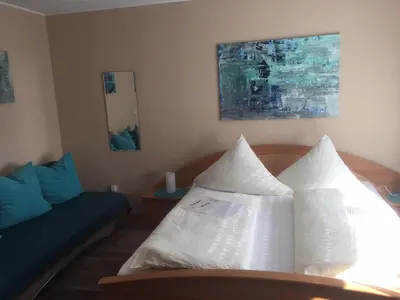 Ein Bett oder Betten in einem Zimmer der Unterkunft Landhaus Am Forst