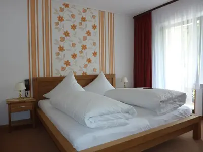 Ein Bett oder Betten in einem Zimmer der Unterkunft Landhaus Am Forst