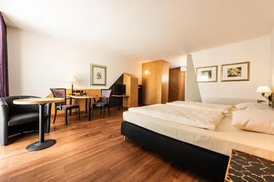 Ein Bett oder Betten in einem Zimmer der Unterkunft ARVENA Kongress Hotel - Hotel in der Wagnerstadt