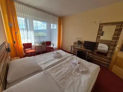 Ein Bett oder Betten in einem Zimmer der Unterkunft Panorama Hotel Oberwiesenthal