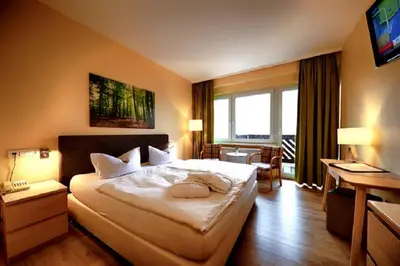 Ein Bett oder Betten in einem Zimmer der Unterkunft Panorama Hotel Oberwiesenthal